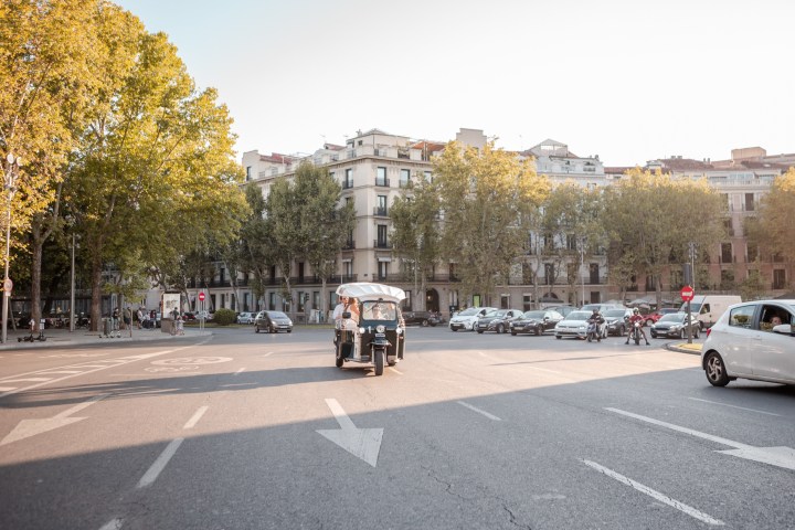 a tuk tuk driving on the street
