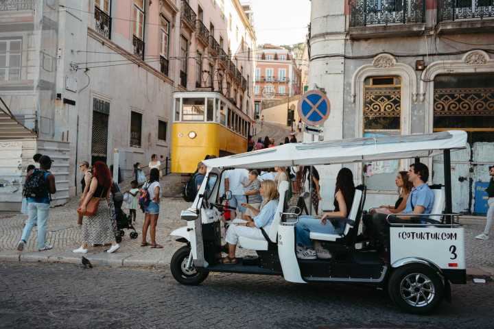 a group of people riding on the back of a truck