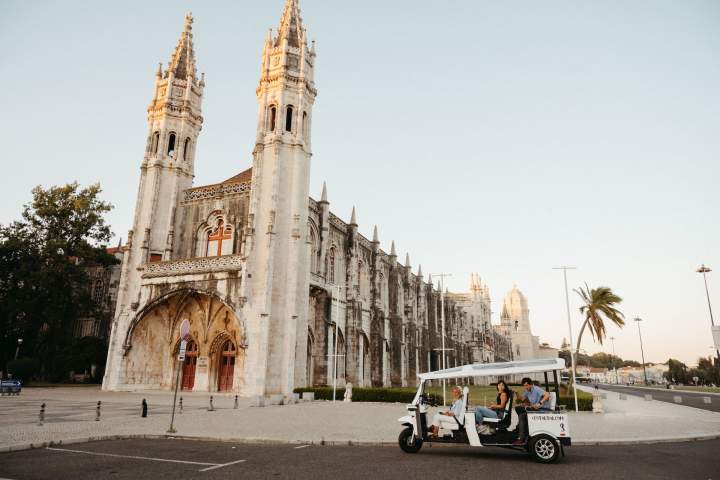 a group of people walking in front of a church