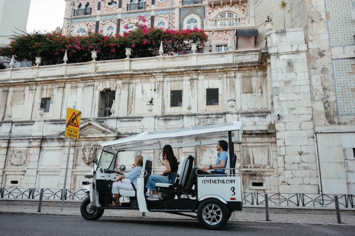 a close up of a horse drawn carriage in front of a building