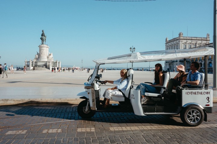 a man riding on the back of a truck