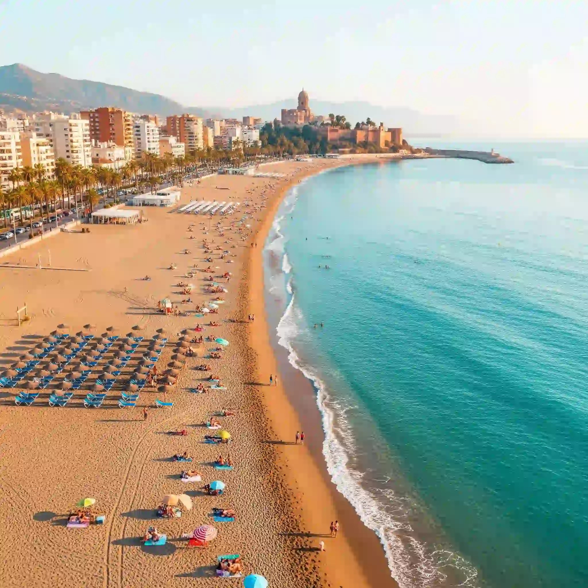 Best Malaga beaches a line of cars on a sandy beach